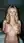 Blonde blue eyes topless bedroom pose