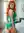 Young curvy redhead bedroom bodysuit pose