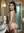 Nude in steamy marble bathroom