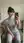 Brunette in crop top taking couch selfie