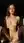 Nude brunette spreads on counter