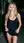 Blonde lifts dress on city street