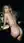 Blonde curves bent over kitchen counter