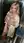 Curvy blonde covers bare tits in elevator