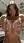 Long wavy brunette squeezes breasts