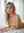 Pink hair topless on white sheets