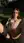 Nude brunette fingers herself in garden