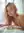Curvy pink hair topless on white sheets