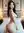 Nude from behind beside hotel bed