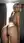 Blonde ponytail over-shoulder thong pose