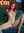 Fiery redhead spreads legs on couch