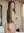 Nude over-the-shoulder bedroom glance