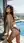 Asian bikini rooftop poolside