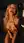 Curvy blonde kneeling nude in kitchen