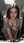 Brunette cleavage lean over table