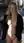 Nude blonde flashes coat on sidewalk