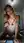 College blonde leaning forward in bed