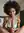 Smiling ebony handjob on bed