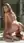 Nude blonde on marble bathroom floor