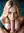 Mariia Kneeling on Blue Bedding