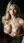Busty blonde lifts breasts in bath