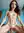 Daria straddling on the bed