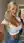 Platinum blonde mirror selfie in crop top and jeans