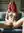 Early 20s redhead spreads on couch