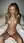 Nude blonde sitting upright in bed