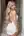 Platinum blonde in backless white dress