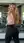 Young curvy blonde gym mirror selfie in pink crop
