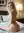 Nude over-shoulder bedroom pose