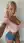 Young adult blonde selfie in pink crop top