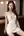 Young adult in white mini dress