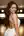 Curvy brunette in backless dress