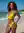 Beach bikini pose with ocean waves
