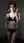 Young redhead lingerie bedroom pose