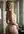 Blonde looks back over shoulder nude