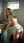 Young adult blonde bent over washing machine