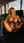 Curvy blonde spreads pussy in office