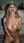 Nude blonde on kitchen floor