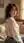 College age Asian over shoulder glance