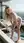 Curvy blonde bends over rooftop pool
