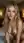 Topless blonde leaning forward