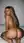 Nude curvy blonde from behind on bed