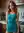Redhead in turquoise dress kitchen